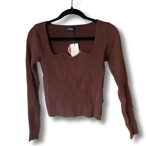 Brown ribbed long sleeve cropped shirt with square, detailed neckline.